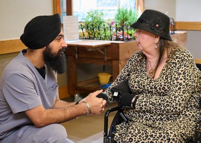 An elderly woman talking to a younger man at Turlock